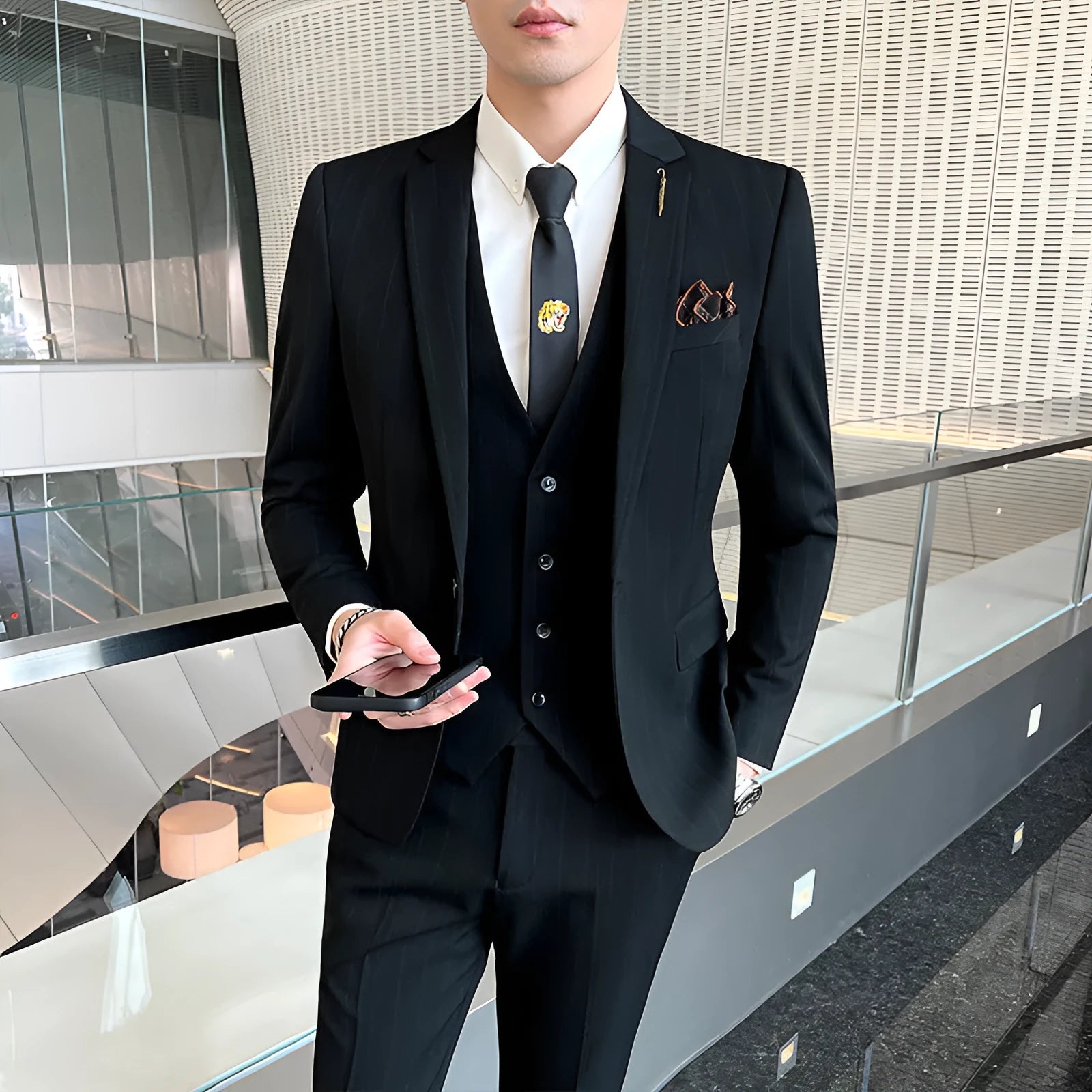 Men's three-piece striped suit set in black, slim fit, with jacket, vest and trousers on a hanger