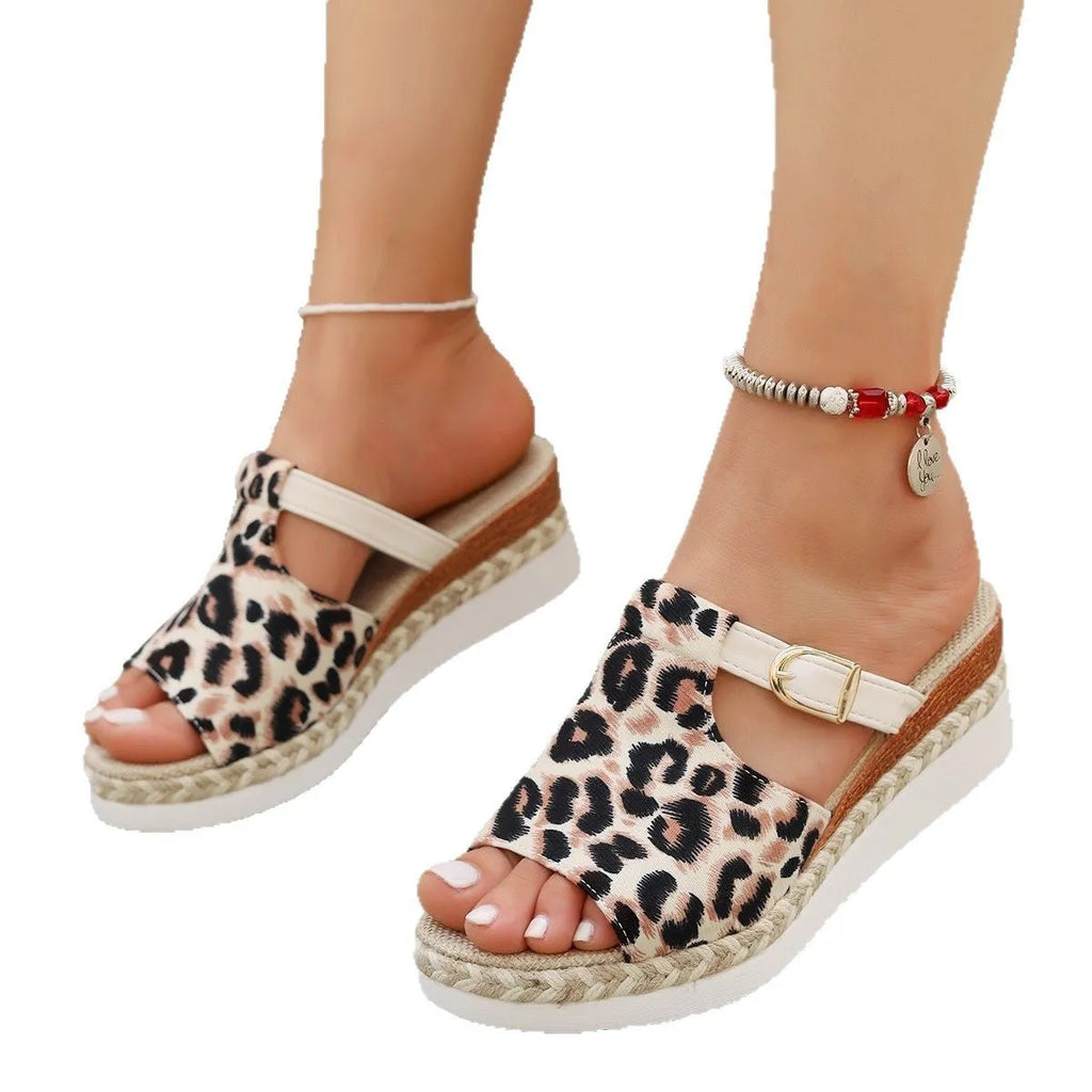 Leopard print wedge platform sandals in beige on a plain background, showing fish mouth toe design.