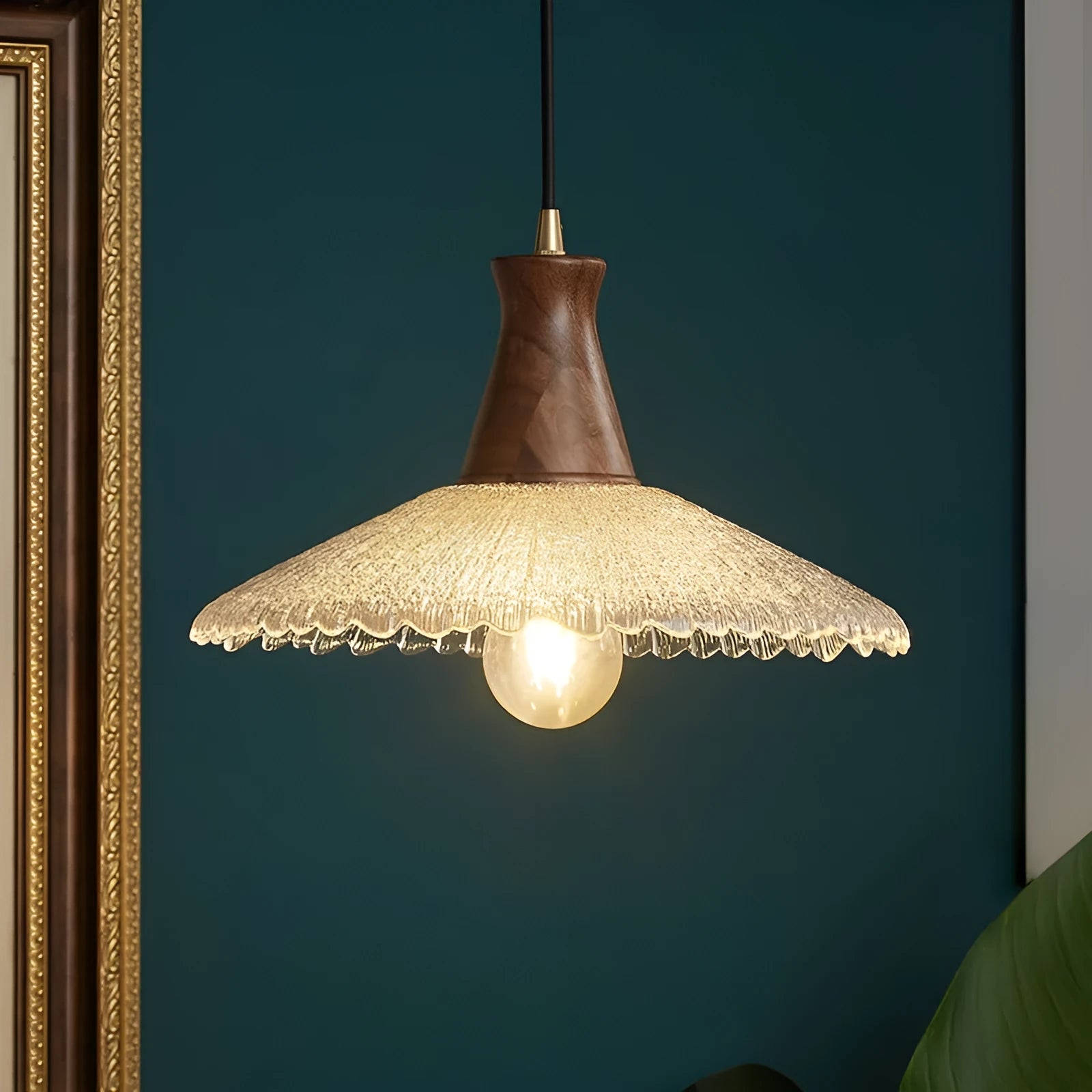 Wood and brass electroplated ceiling chandelier with a glass lampshade.