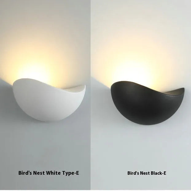 Black bird's nest style aluminium alloy LED lamp with warm white glow.