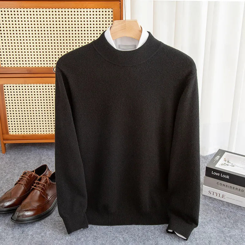 Man wearing a loose fit half-turtleneck wool sweater in a camel colour.