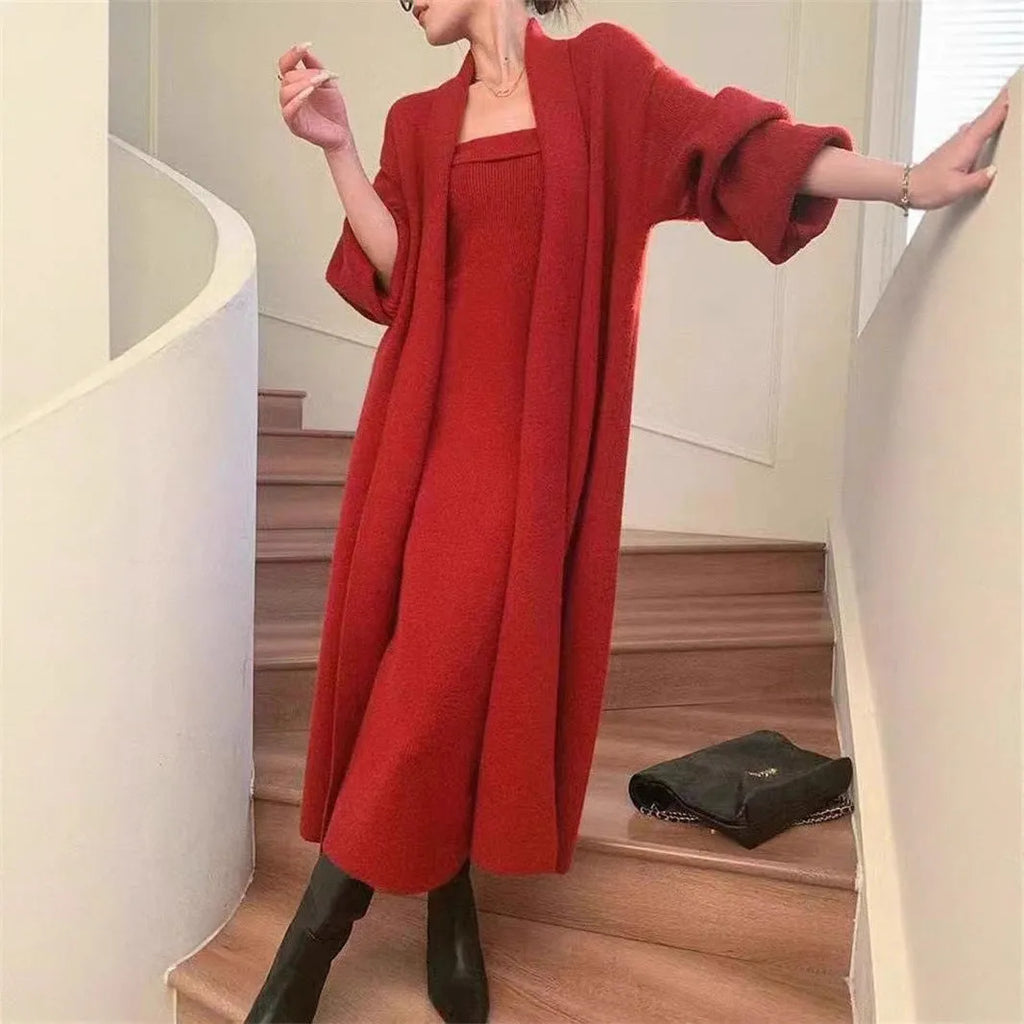 Women's grey knitted long-sleeve dress and matching cardigan set laid flat.