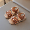 Girls soft bottom sandals with Velcro fastening and artificial leather upper in solid colours