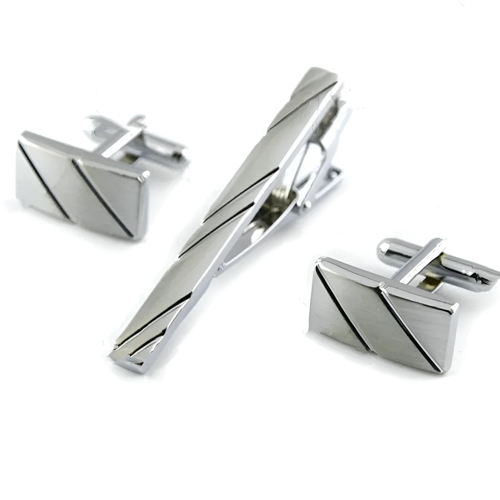 Men's silver diagonal rectangle alloy cufflinks with matching tie clip on white background