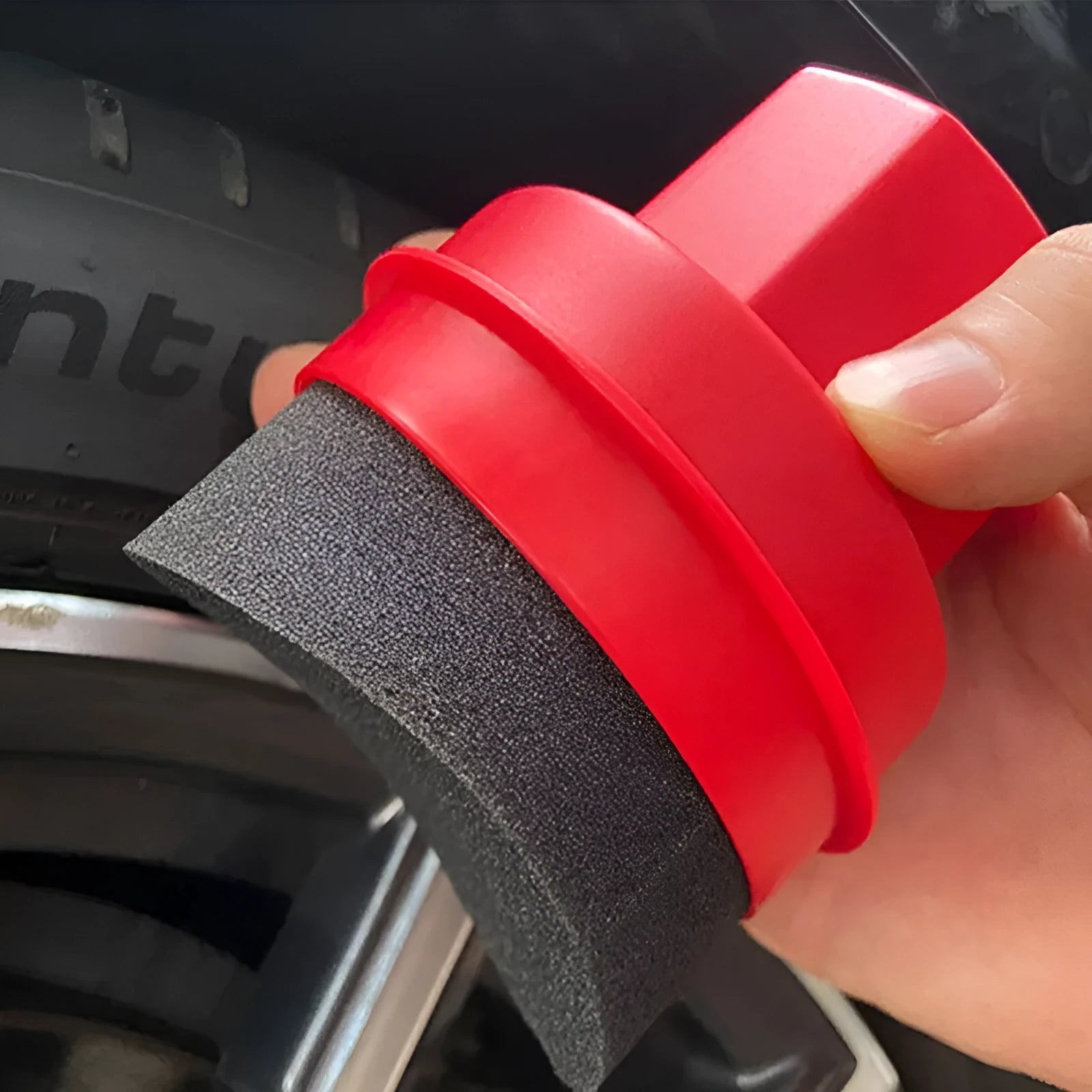 Black car tyre polishing sponge brush with handle and lid, showing dense sponge for applying tyre dressing.