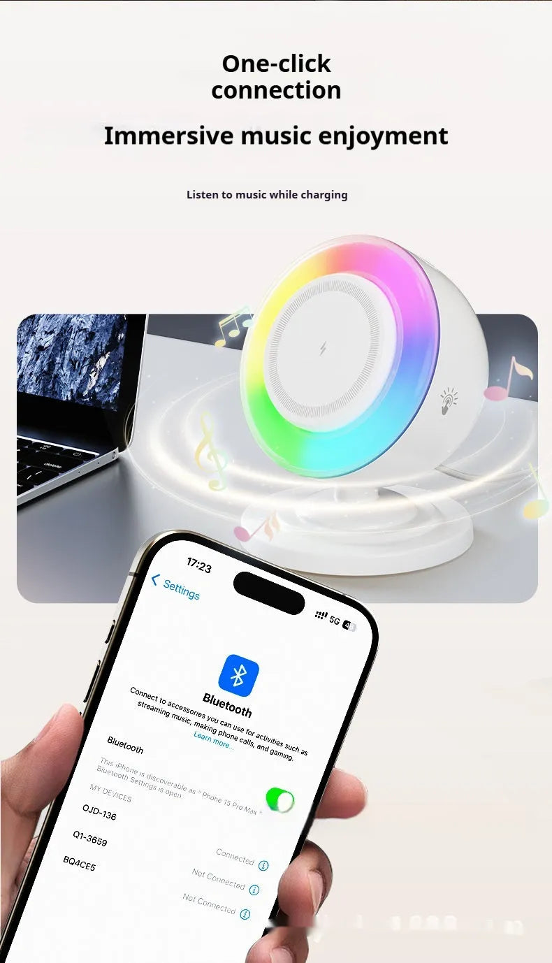 Three-in-one wireless charger with Bluetooth speaker and coloured lights in white finish on a desk