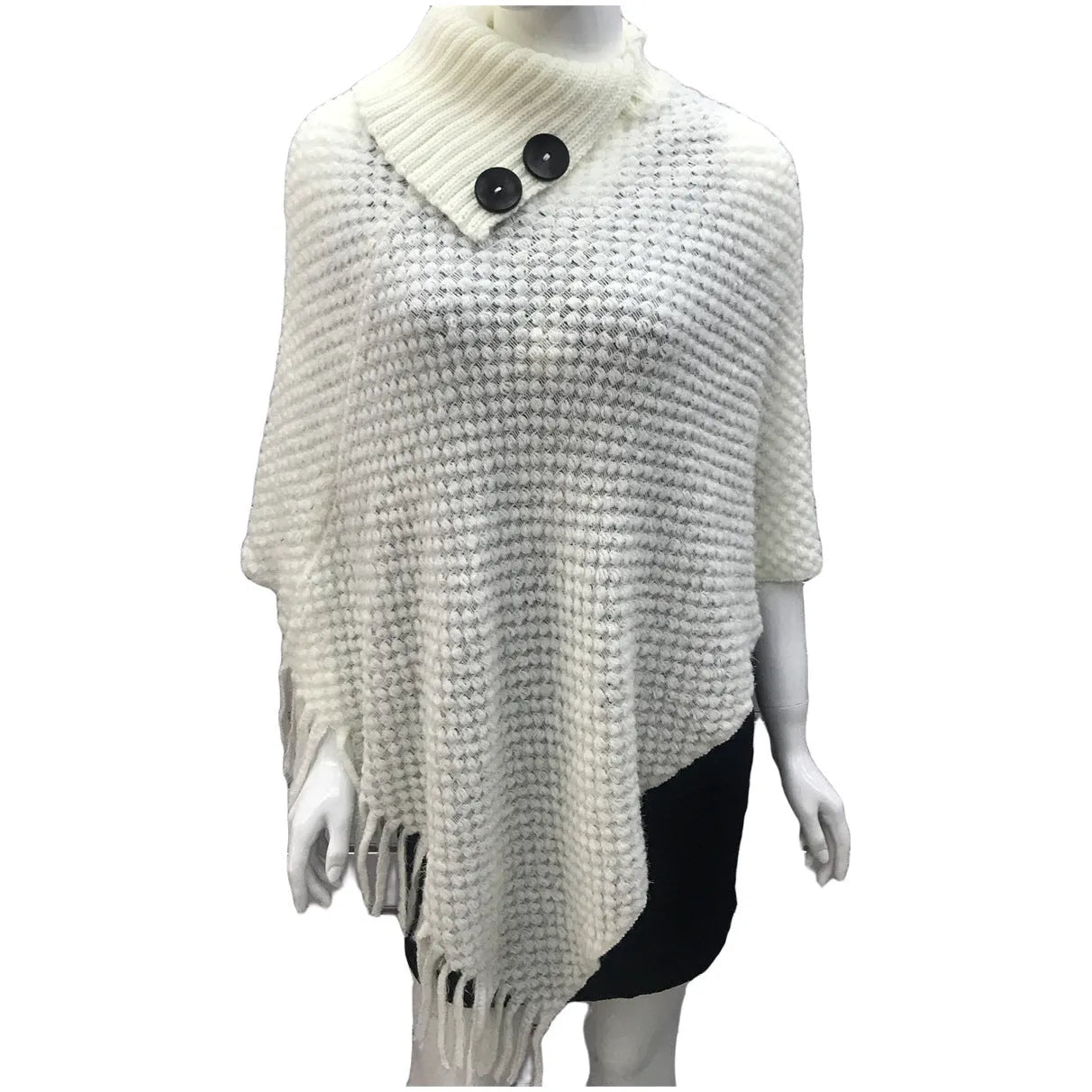 Sleeveless polka dot knit cloak in apricot colour, shown as a vest on a hanger.
