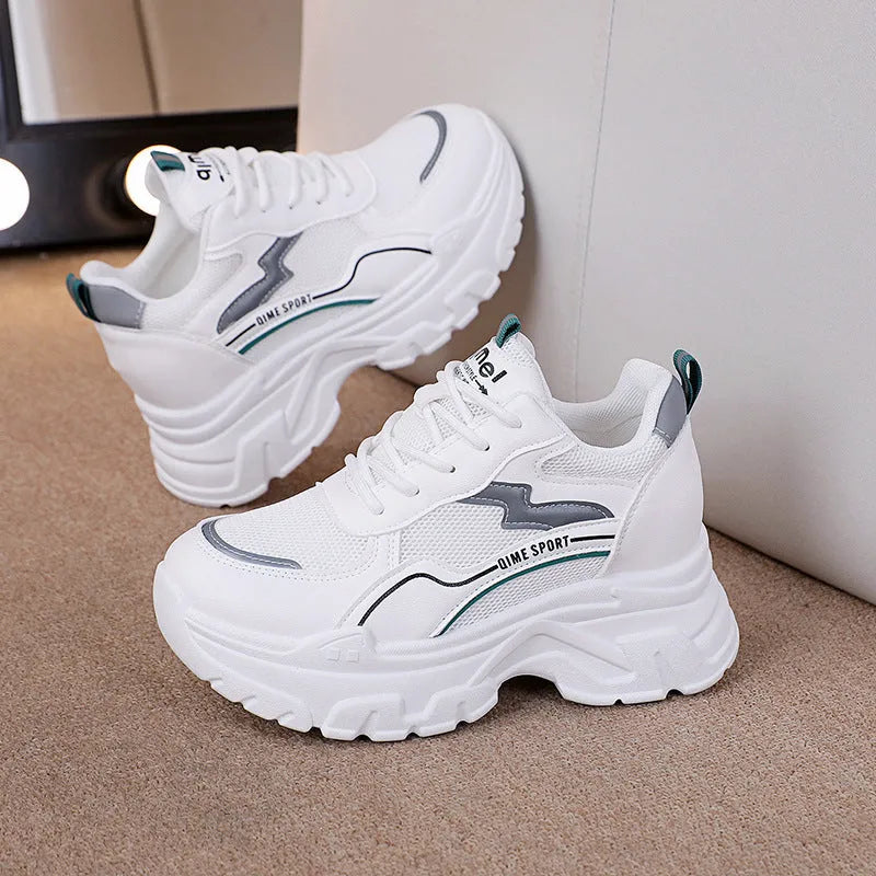 Women's white breathable dad shoes with lace-up front and cross shoulder straps on a rubber sole.
