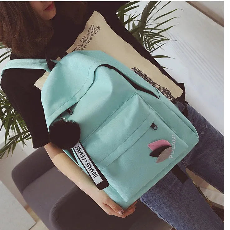 Green canvas college schoolbag with casual styling and anti-theft features
