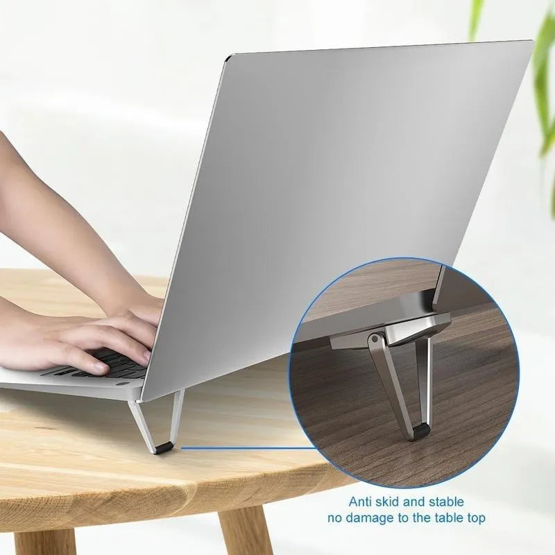 Aluminium alloy folding laptop bracket showing compact 4.8cm height with adhesive backing