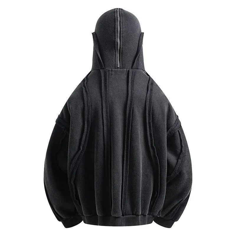 Man wearing a black retro-style zip-front cotton hooded coat with abstract pattern.