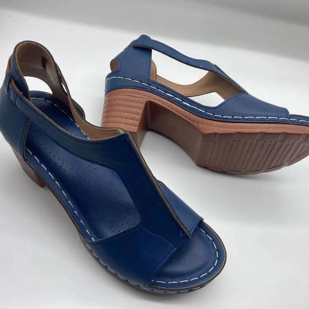 Plus size women's beige peep toe wedge sandals with a buckle strap and low heel.