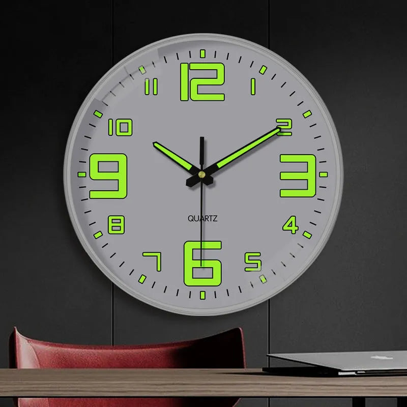Modern 8-inch luminous wall clock with white face and black numbers on a wall.