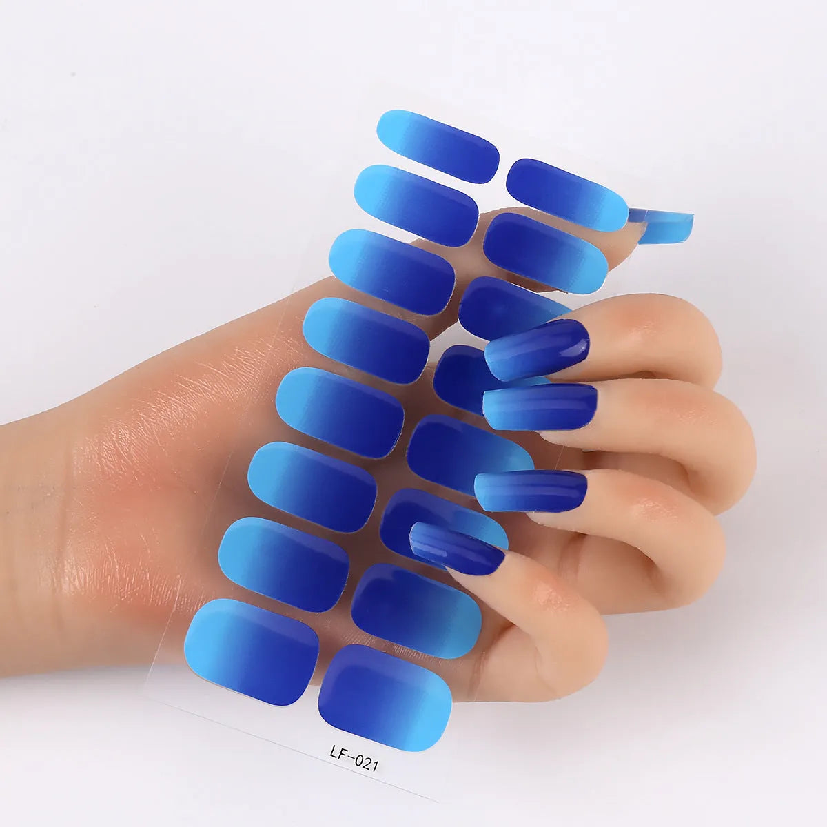 Pack of solid colour nail art stickers showing 16 different small designs including flowers, animals, and geometric patterns.