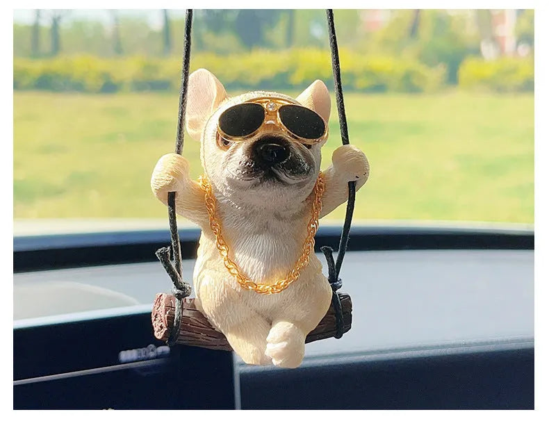 Small resin bulldog cartoon pendant for hanging on a car rearview mirror.