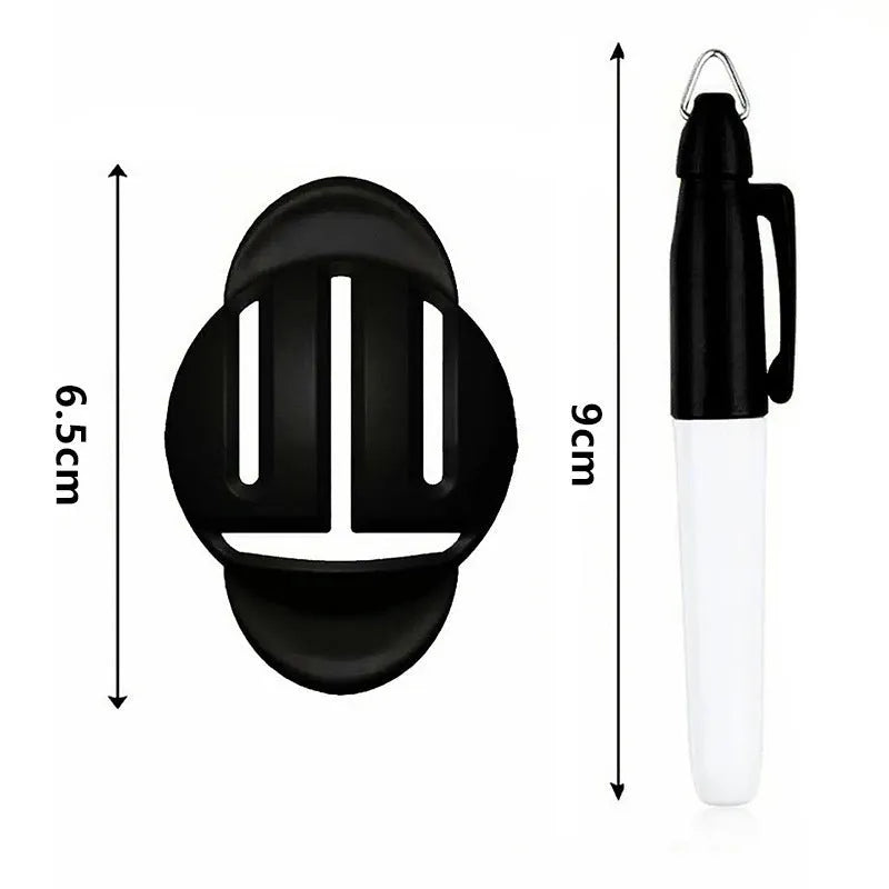 White plastic golf putting alignment tool holding four metal scribers, with a drawing pen inserted in the side holder, on a green golf putting mat.