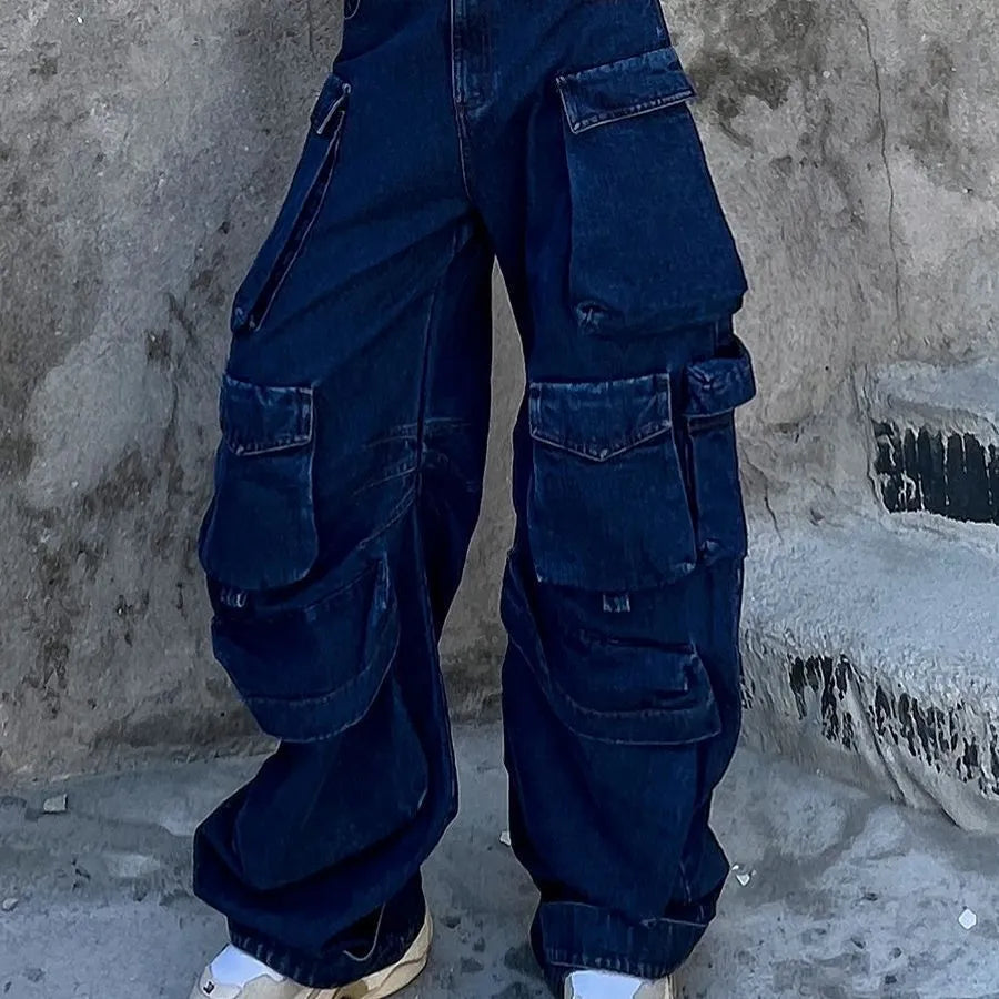 Dark blue distressed wide-leg jeans with a high waist and multiple pockets laid flat