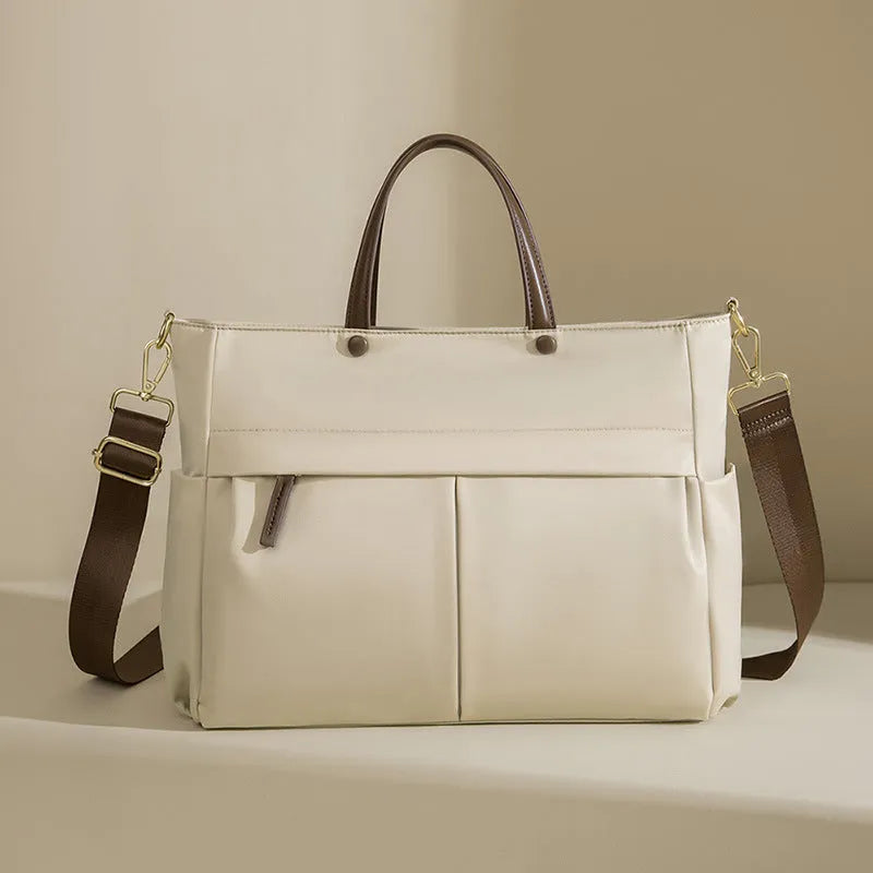 Women's oxford cloth portable briefcase in nuts and apricots colour with contrast stitching.
