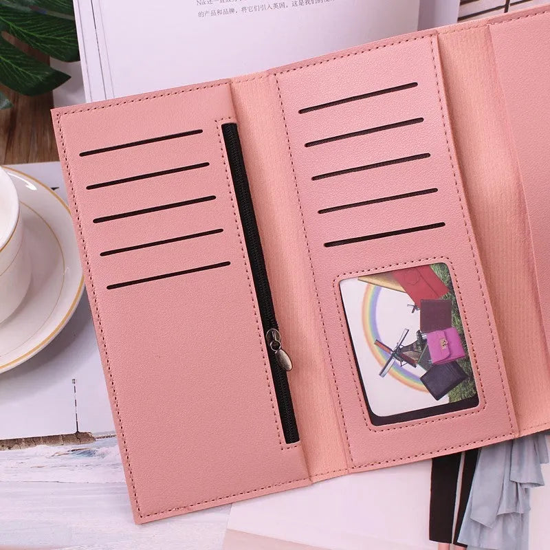 Women's long tri-fold clutch wallet in solid colour with sewing thread detail, PU leather exterior, large capacity