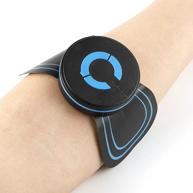 Black mini electric shoulder and neck massager with massage patch next to its 15cm long packaging.
