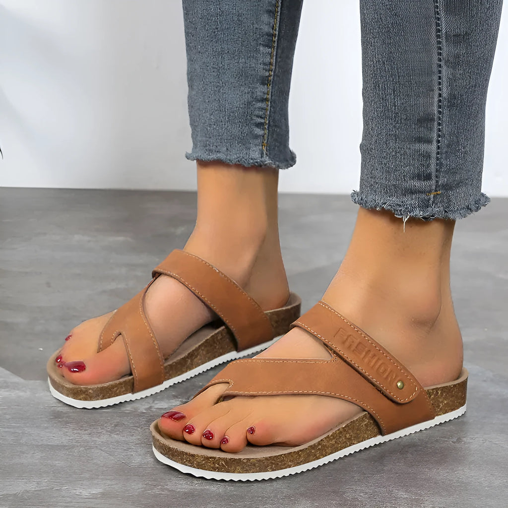 Flat thick-soled toe ring flip-flops in blue, showing artificial PU upper and foam sole.