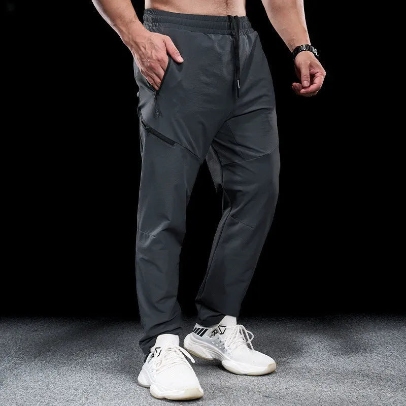 Men's waterproof quick-drying nylon workout trousers in multiple colours for sports and exercise