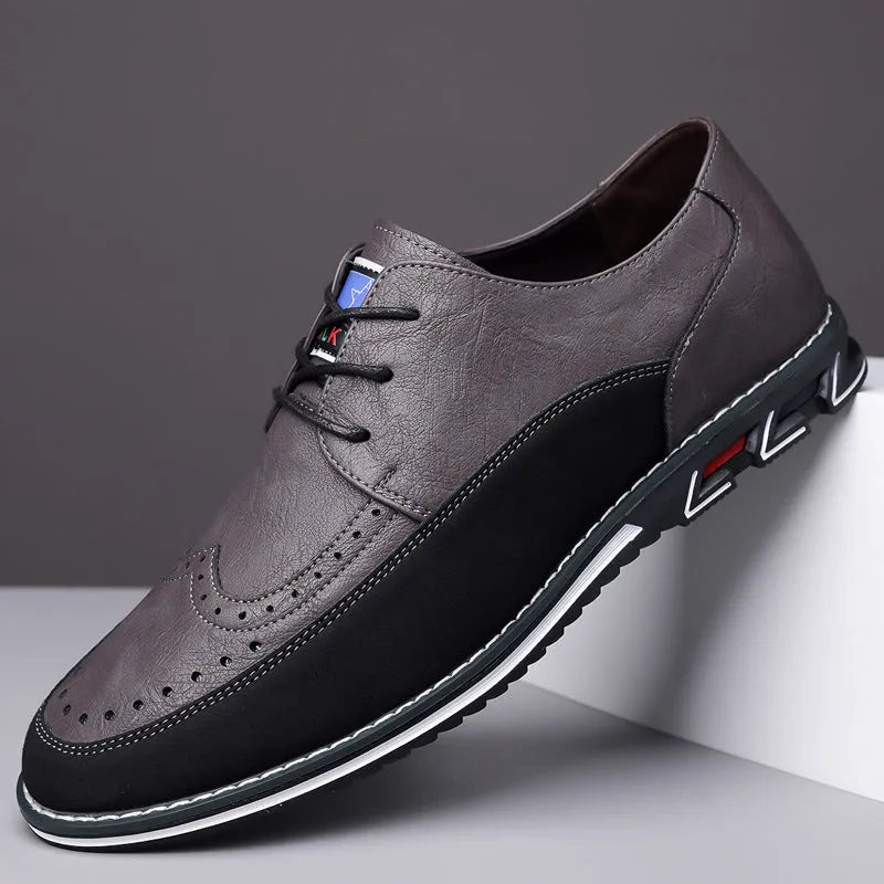 Men's low-top casual leather shoes with a leather toe cap and sewing line detail on fabric upper.