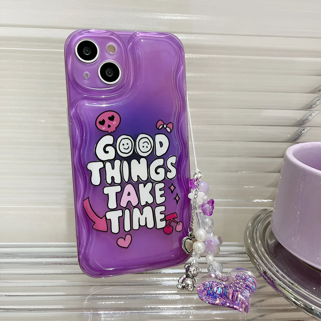 Purple graffiti love design iPhone 14 phone case with an attached silver chain bracelet.