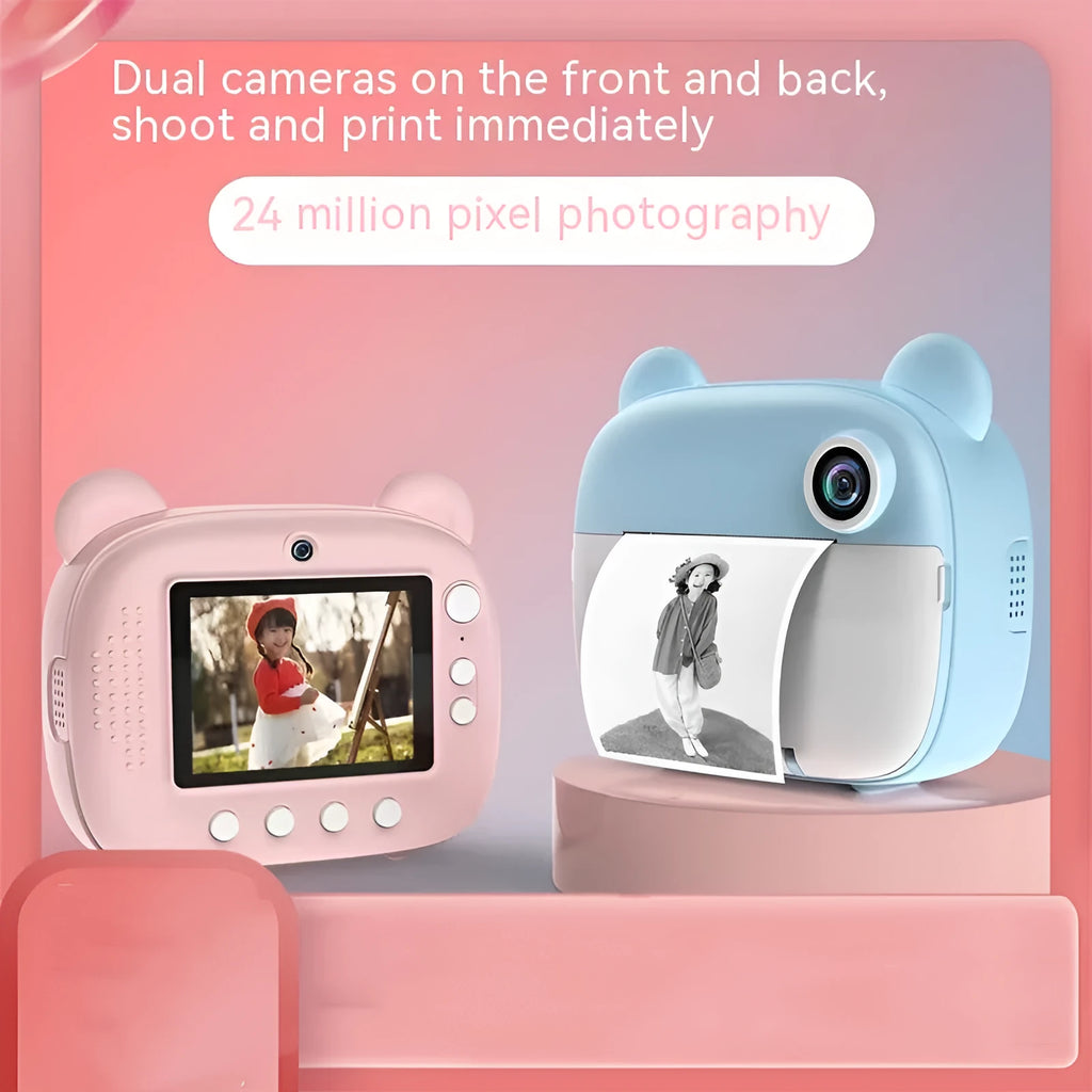 Pink children's printing camera with HD dual lenses, lanyard, and crayons on white background