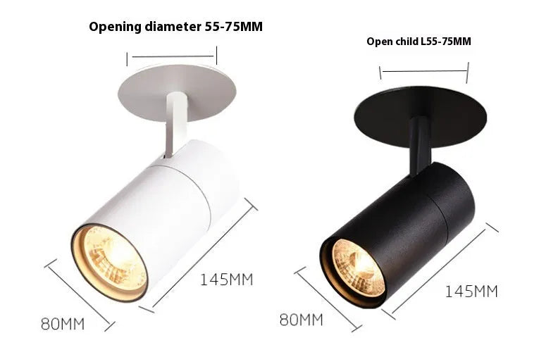 Black recessed cylinder LED spotlight installed in a ceiling track, showing adjustable head.
