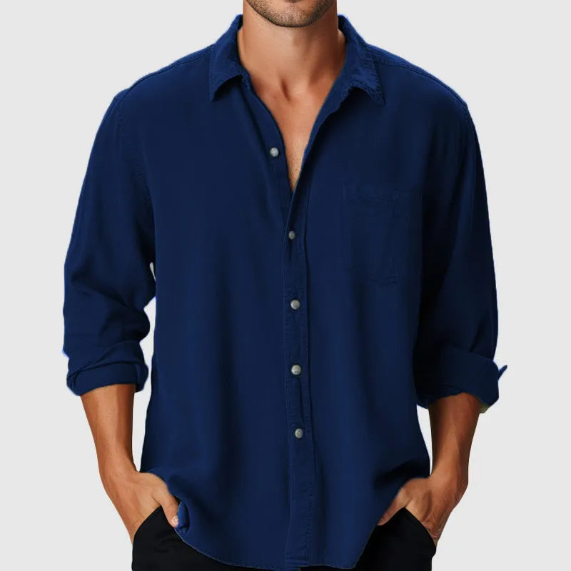 Men's loose fit long sleeve polyester shirt with a stand collar, shown in a casual setting.