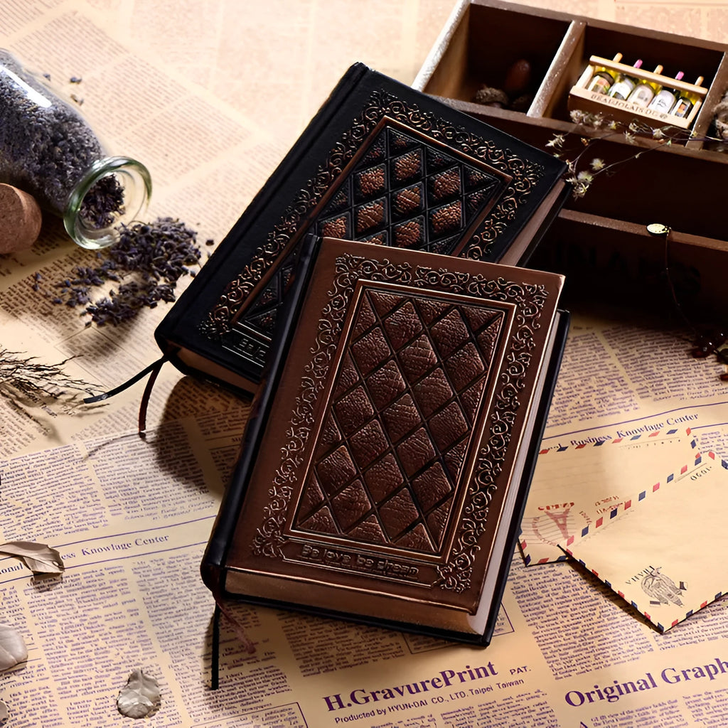 Embossed faux leather notebook with a thick notepad, shown in bronze and black gold colour options.
