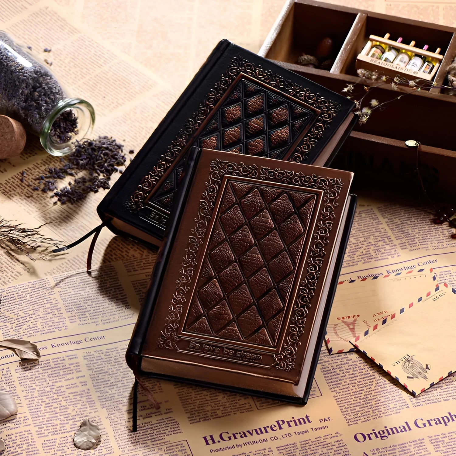 Embossed faux leather notebook with a thick notepad, shown in bronze and black gold colour options.