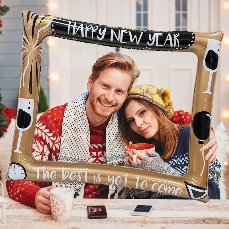 Red and white Christmas-themed inflatable photo frame prop with festive designs.
