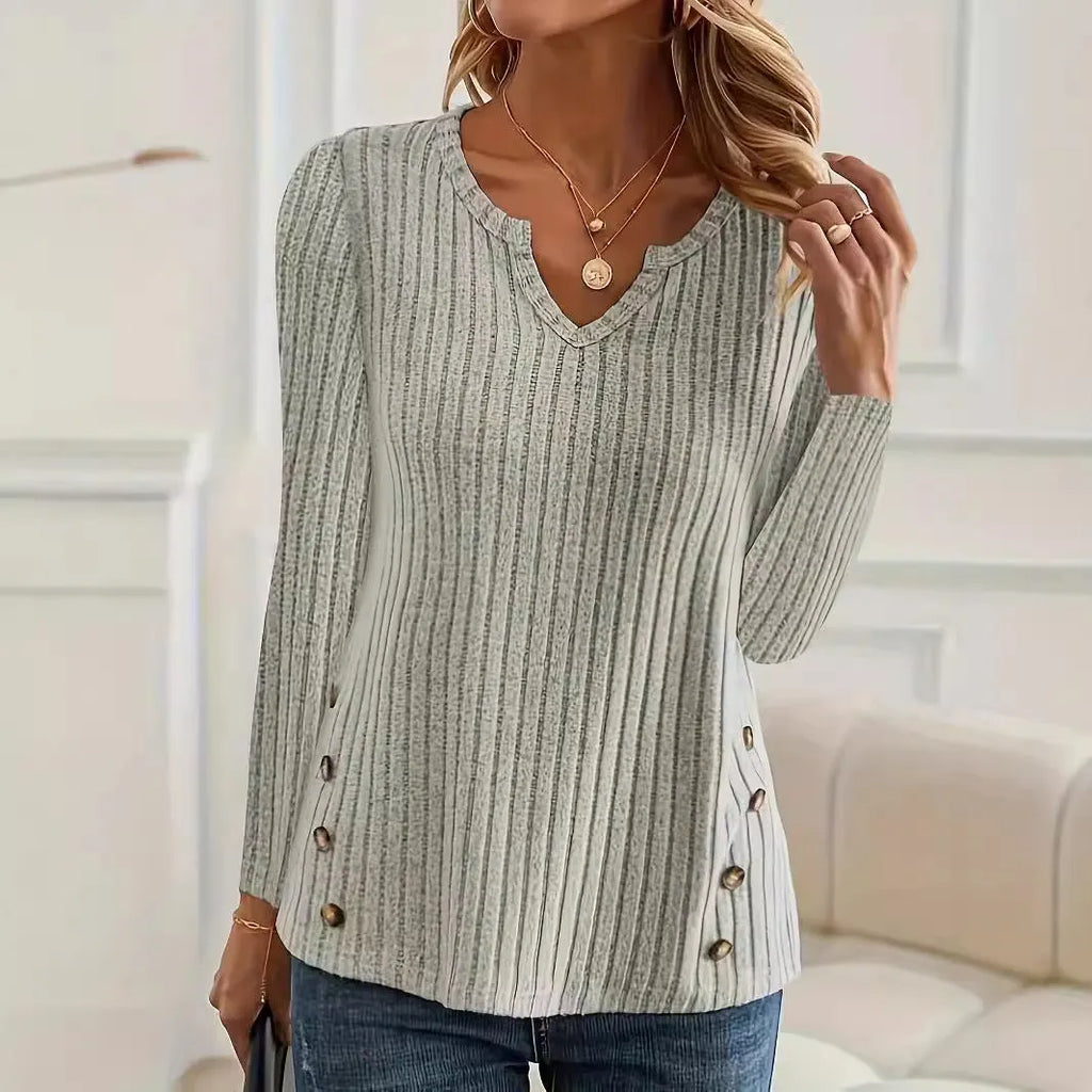 Simple grey green casual knitted button sweater pullover laid flat.