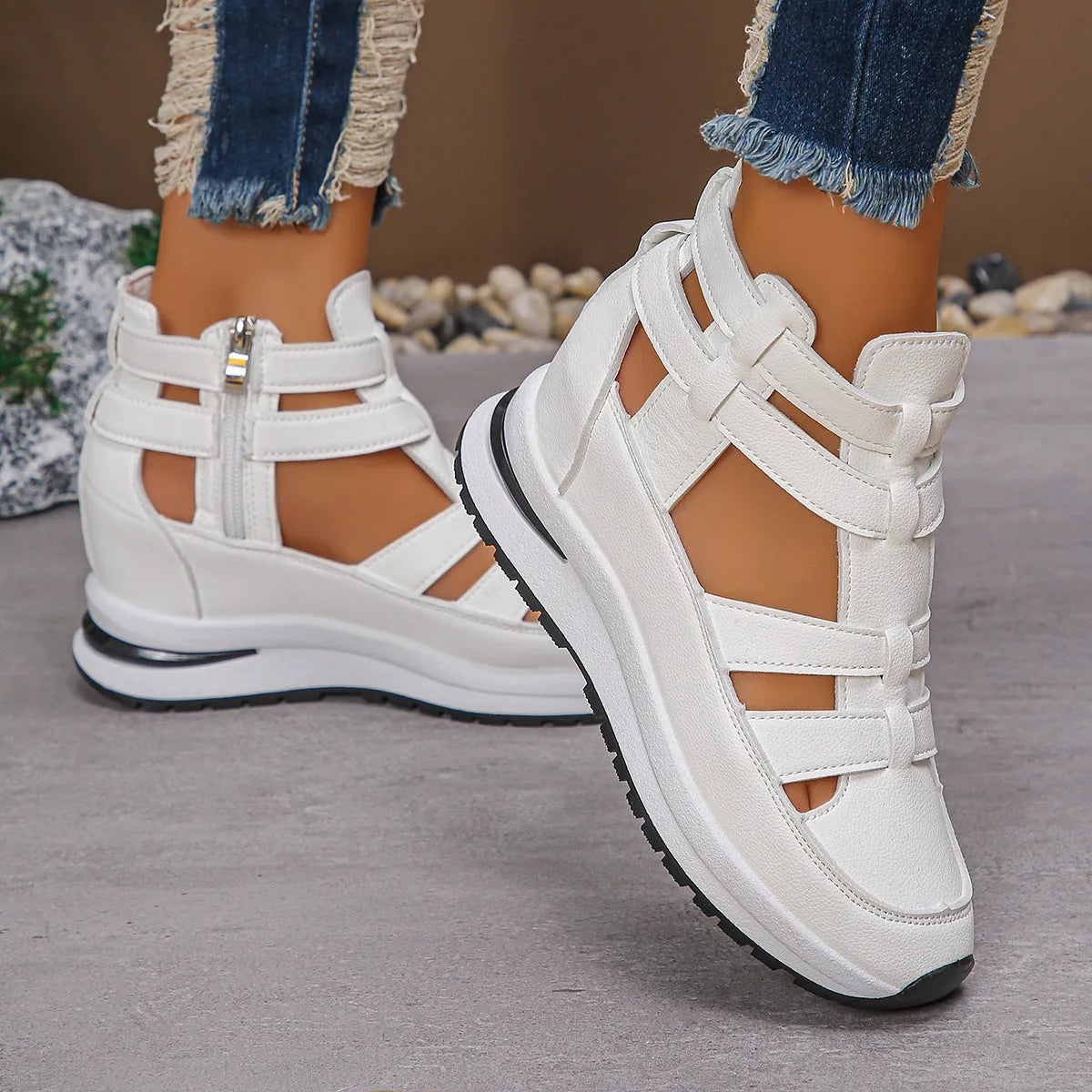 Black women's platform sandals with closed toe, hollow-out design and Velcro strap.