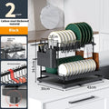 Modern white and black double-tier kitchen storage rack for draining utensils.