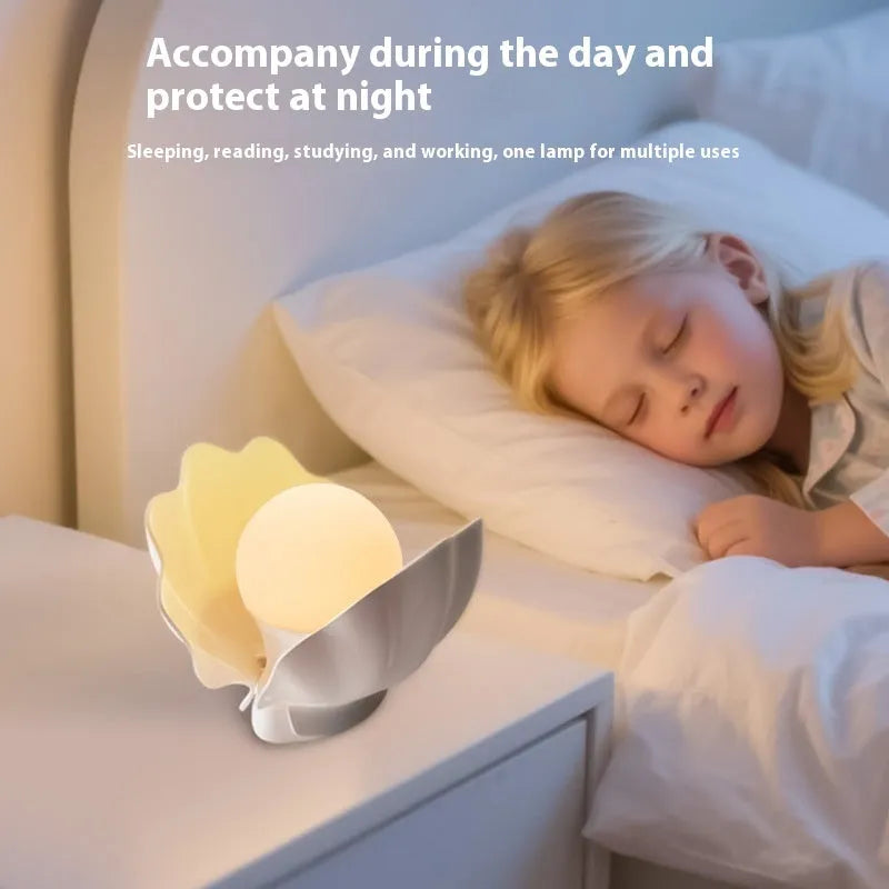 Shell pearl coloured silicone pat induction night light with power storage, disk shape 140x145x160 mm