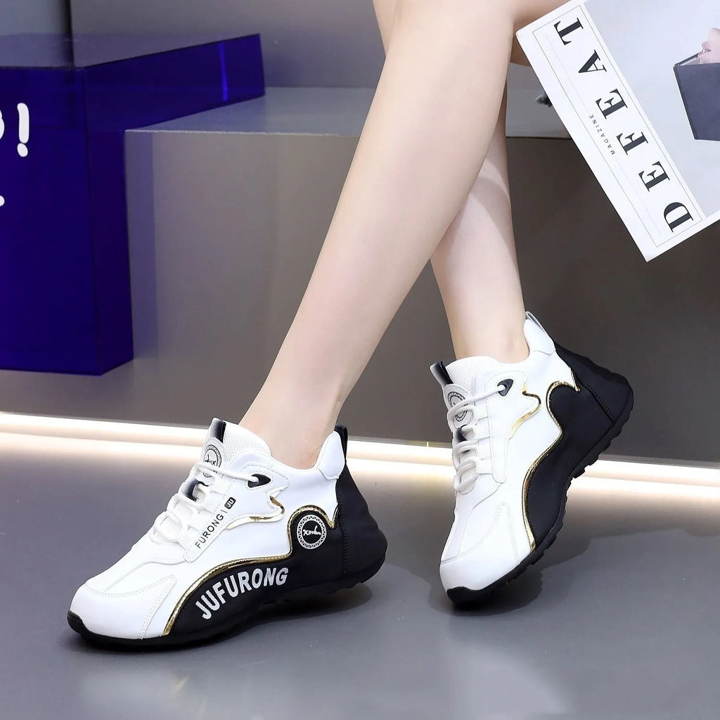 Casual mid-top cowhide leather sneakers with front lace-up, round toe, and plastic sole in black and white colourway