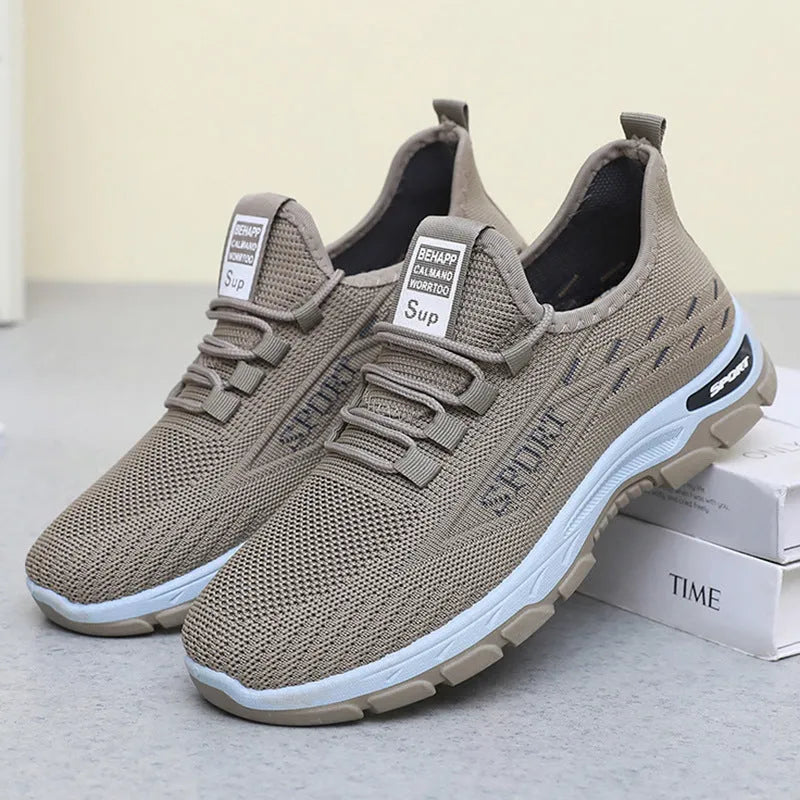 Men's and women's low-top casual sneakers with soft PVC sole in black, brown, grey, light purple, and red.