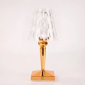Rose gold portable touch control night light with rechargeable battery on a surface