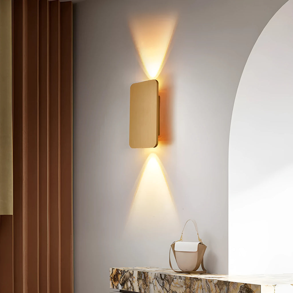 Minimalist black nordic wall lamp mounted beside a bed, emitting warm white light.