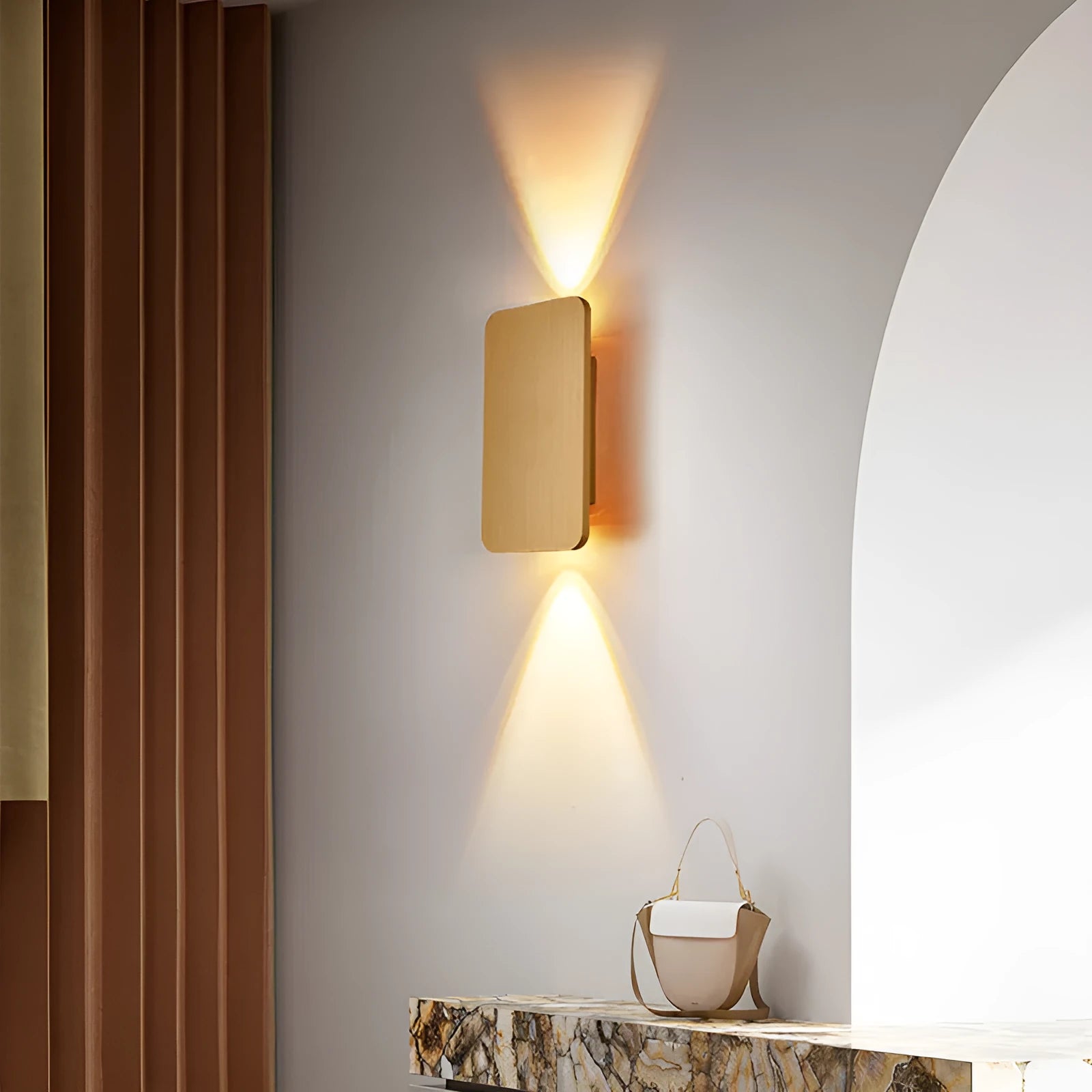 Minimalist black nordic wall lamp mounted beside a bed, emitting warm white light.