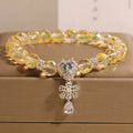 White crystal women's bracelet with butterfly and water drop charms on a metal chain, Japanese Korean style snowflake element.