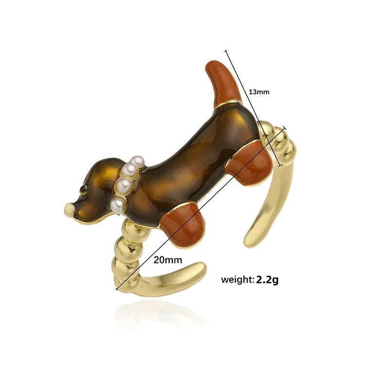Copper open mouth ring with colourful drip oil finish and sausage dog animal motif