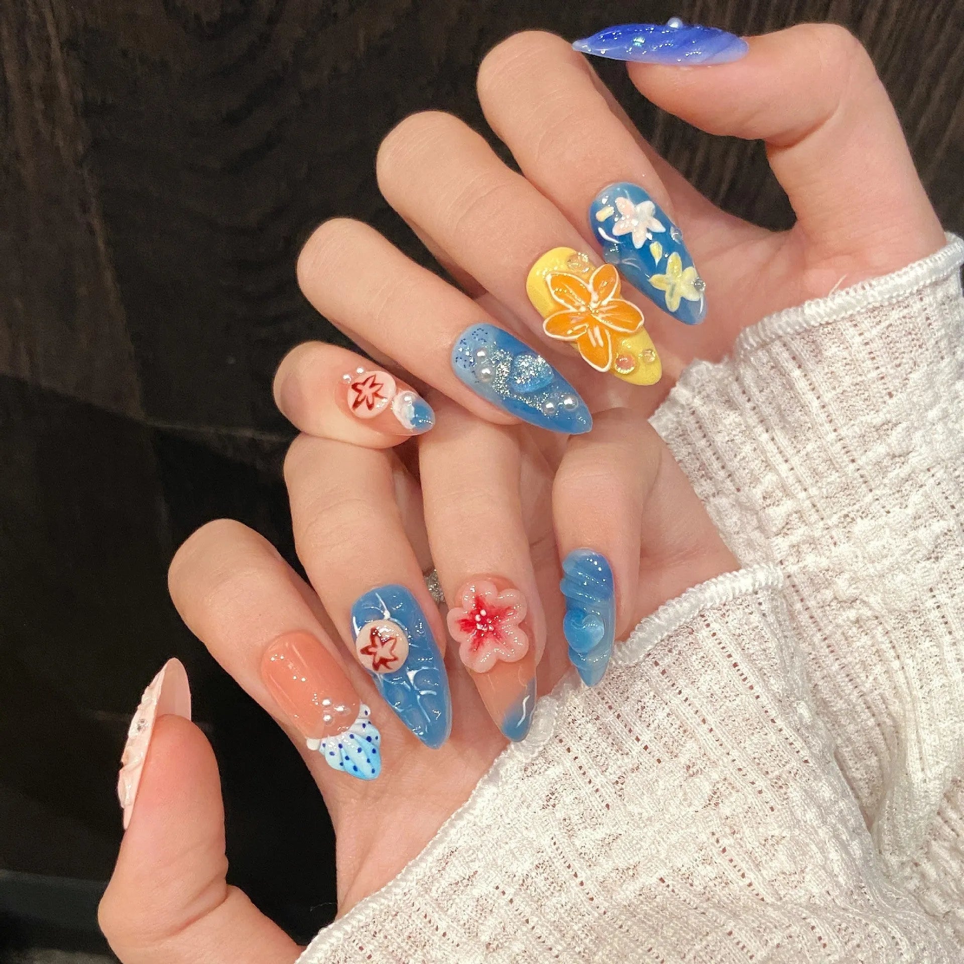 Three-dimensional carved plastic jellyfish wearable armour in almond nail colour for cosplay.