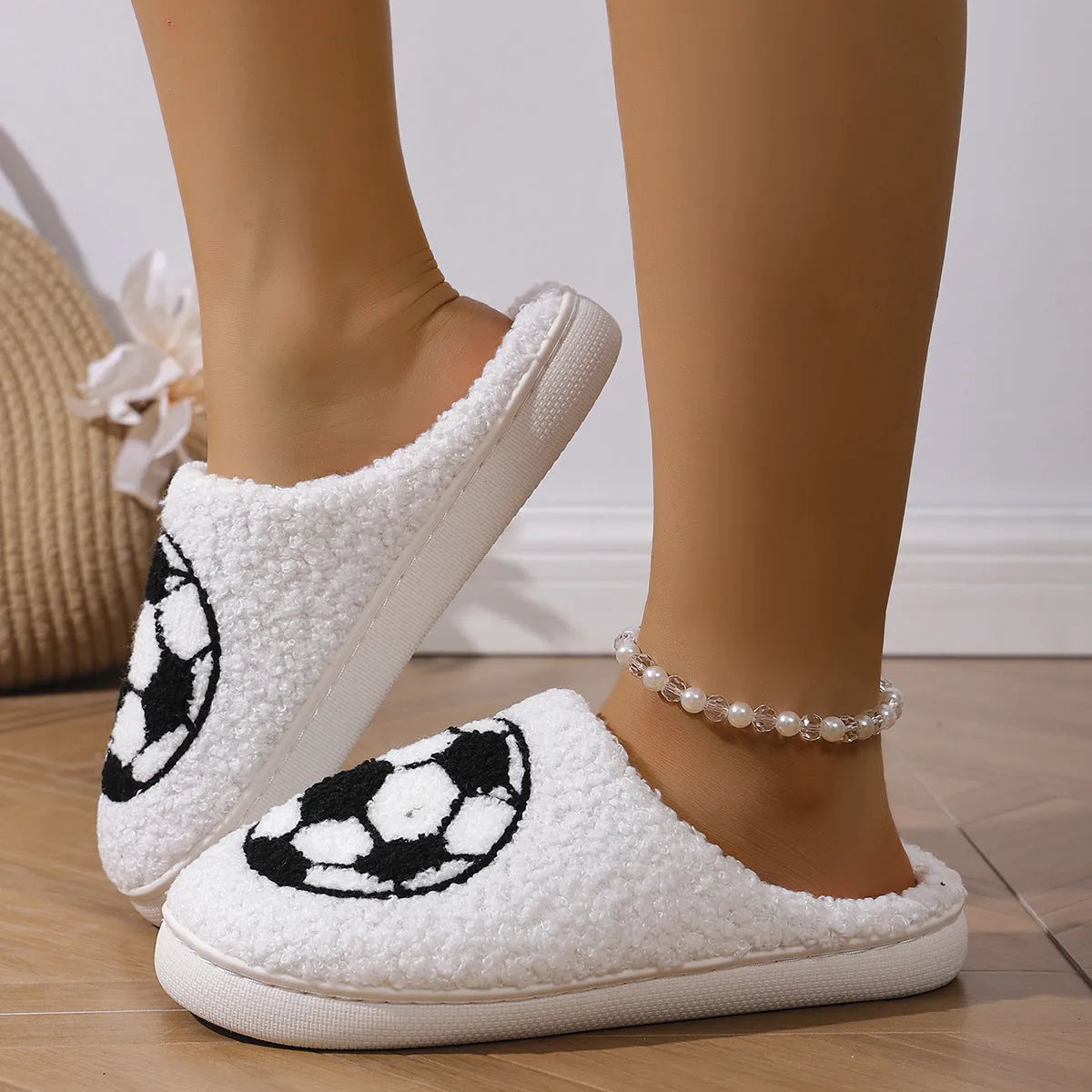 White thermal cotton slippers with ethnic totem pattern, plush upper, and TPR sole on a floor