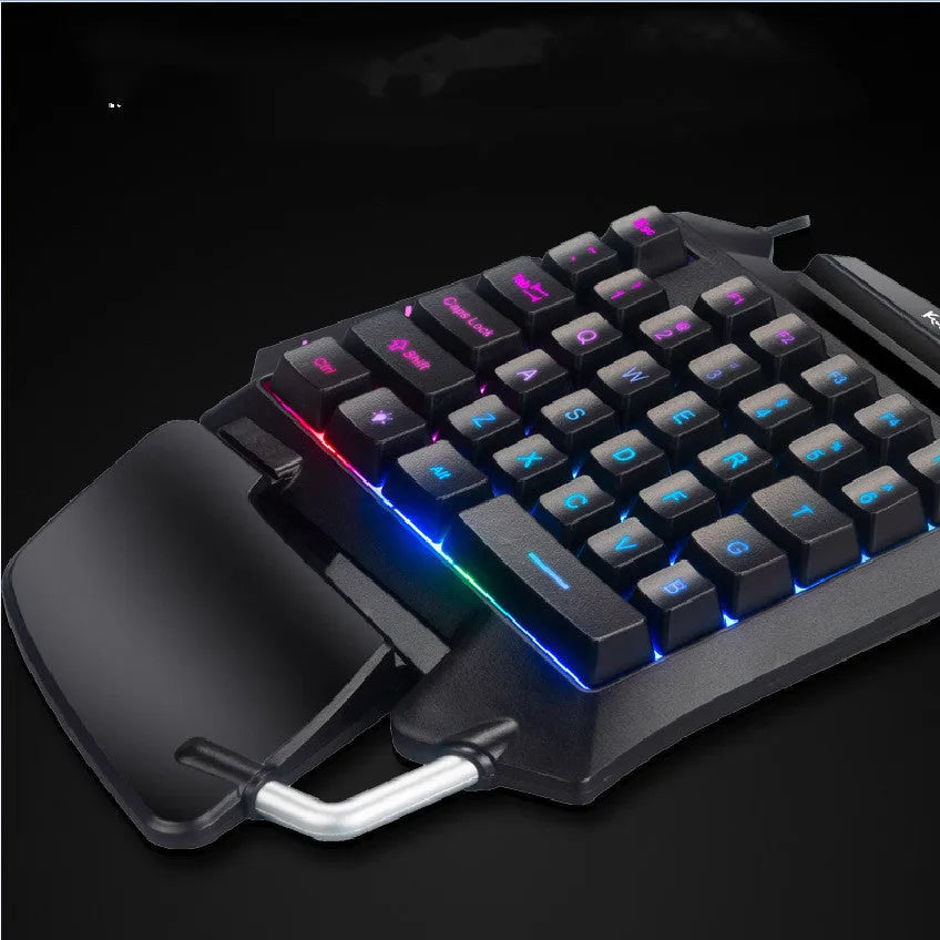 Black left-hand Throne gaming keyboard with wrist rest and USB connector for desktop PUBG gaming
