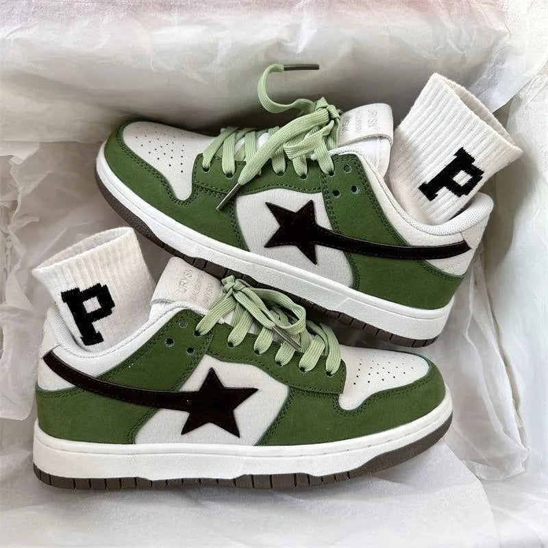 Retro style women's board shoes in green with lace-up closure and flat rubber sole