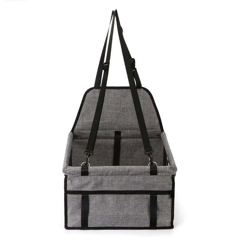 Foldable pet safety seat car bag in black Oxford cloth on a car seat with safety tether visible